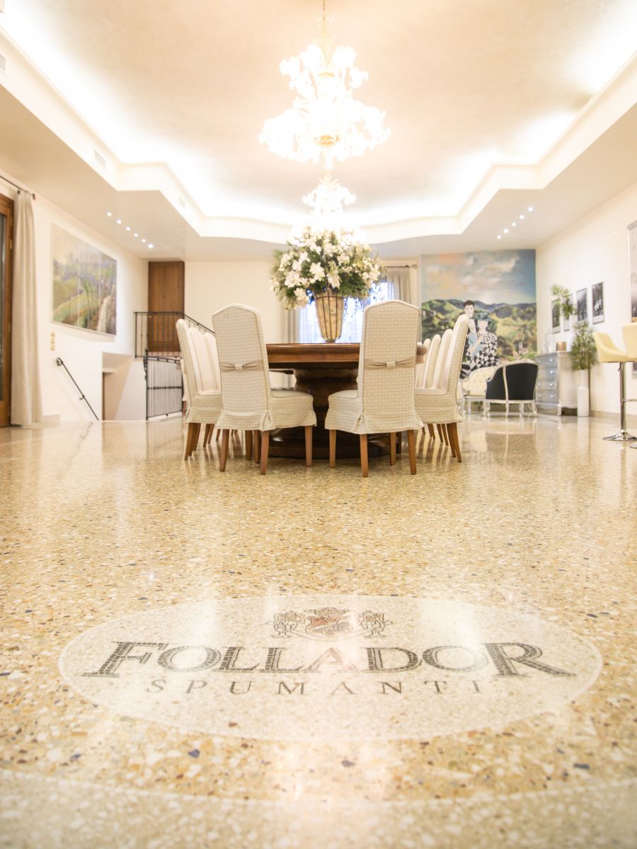 large room with marble floor with follador logo